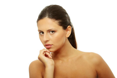 Portrait of young woman against white background