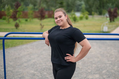 Full length portrait of woman smiling