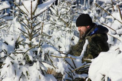 Person in snow covered tree