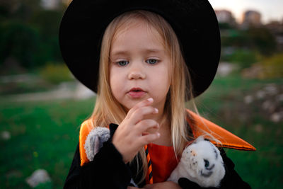 Portrait of cute girl wearing hat