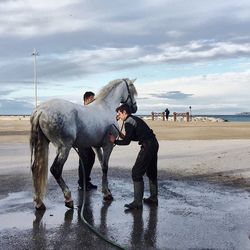 Full length of man on beach against sky