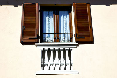 View of window with wooden shutters