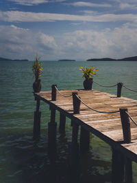 Pier on sea against sky