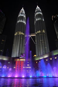 Low angle view of illuminated city at night