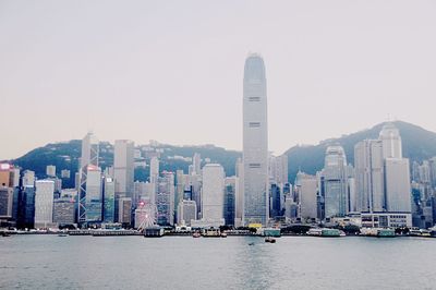 Modern buildings in city against clear sky