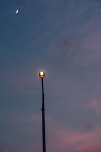 Low angle view of street light against sky during sunset