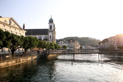 River in city against clear sky