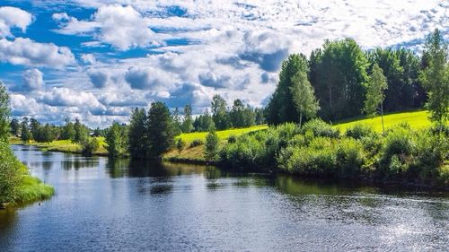 Scenic view of lake against cloudy sky