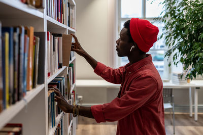 Side view of man working at home