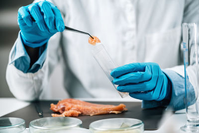 Food safety inspection of raw chicken meat in a laboratory. 