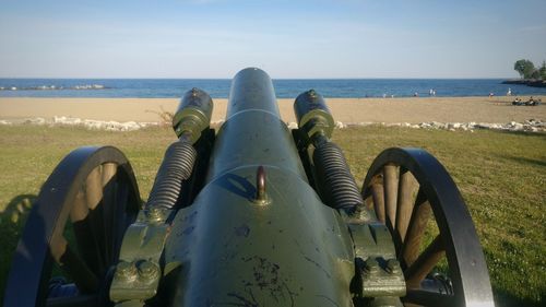 Close-up of beach against clear sky