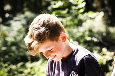 Close-up of boy looking down