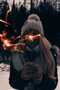 Woman holding sparkler