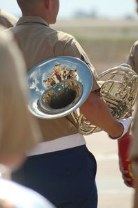 Close-up of cropped hand holding outdoors