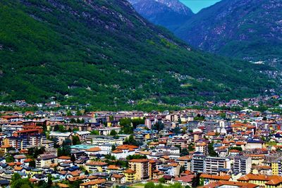 High angle view of houses and mountains against sky