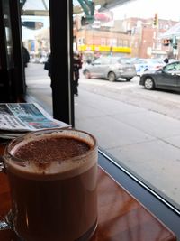 Close-up of coffee cup on table