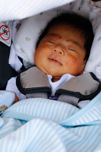 Cute baby sleeping on bed