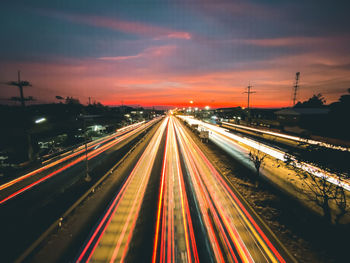 High angle view of light trails on highway at night