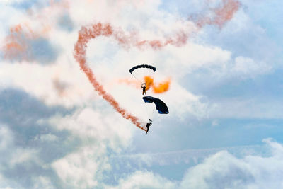 Low angle view of airshow in sky