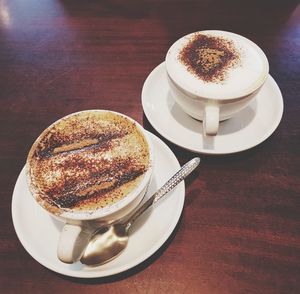 High angle view of coffee cup on table