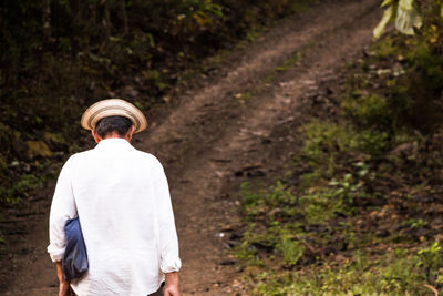 Rear view of man walking outdoors