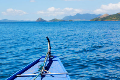 Sailboat in sea against sky