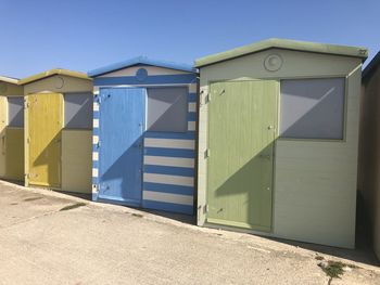 Built structure on beach against clear blue sky