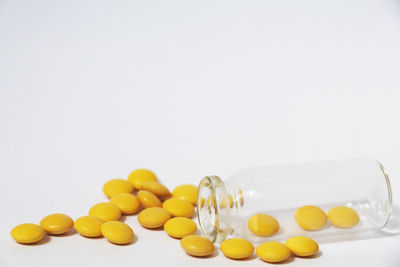 Close-up of yellow eggs against white background