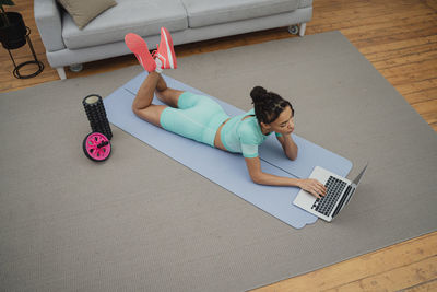 High angle view of boy playing with toy blocks on table