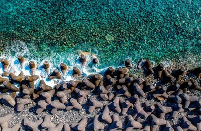 High angle view of concrete tetrapods at seashore