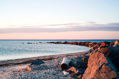 Scenic view of sea against sky at sunset