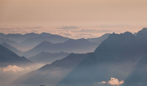 Scenic view of mountains against sky during sunset