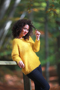 Portrait of young woman standing outdoors