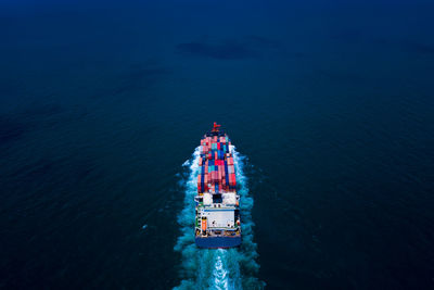 High angle view of ship sailing in sea