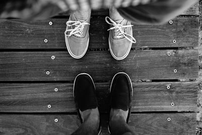 Close-up of the shoes of two men face to face