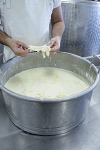 Midsection of person preparing food