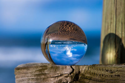 Close-up of crystal ball on rock