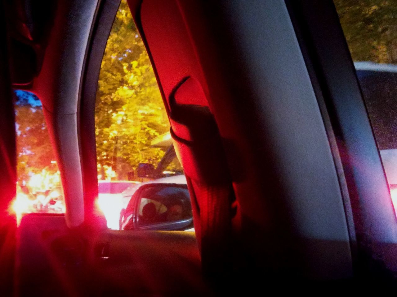 window, transparent, glass - material, indoors, illuminated, vehicle interior, close-up, night, seat, pink color, focus on foreground, domestic life