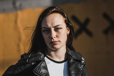 Close-up portrait of young woman on sunny day