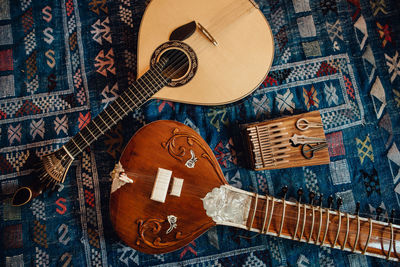 Traditional musical instruments: sitar, portuguese guitar, kalimba