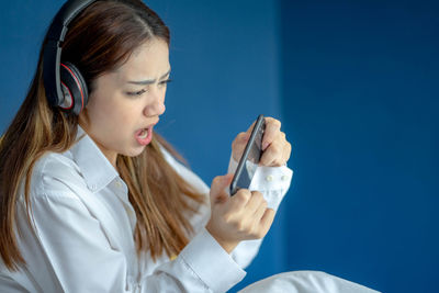 Young woman using mobile phone