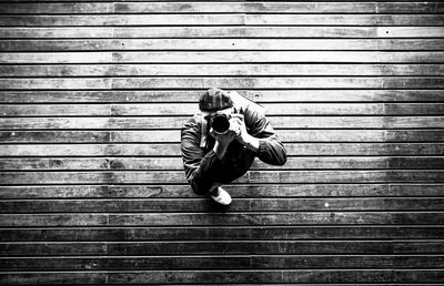 High angle view of man photographing