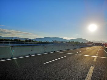 Empty road against sky