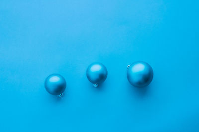 Directly above shot of crystal ball on blue background