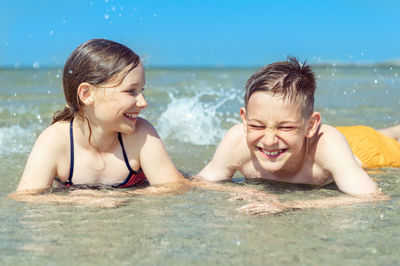 Portrait of happy boy in swimming pool