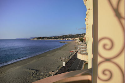 Panoramic view of beach against clear sky