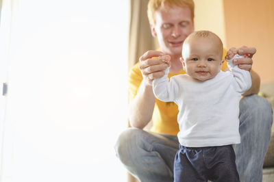 Cute mother with baby at home