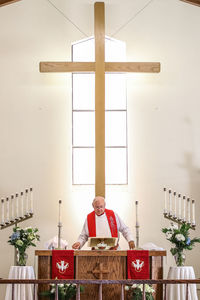 Priest standing in church