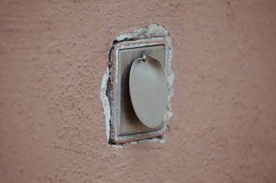 Close-up of old socket on wall