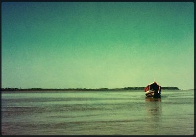 Scenic view of calm sea against clear sky